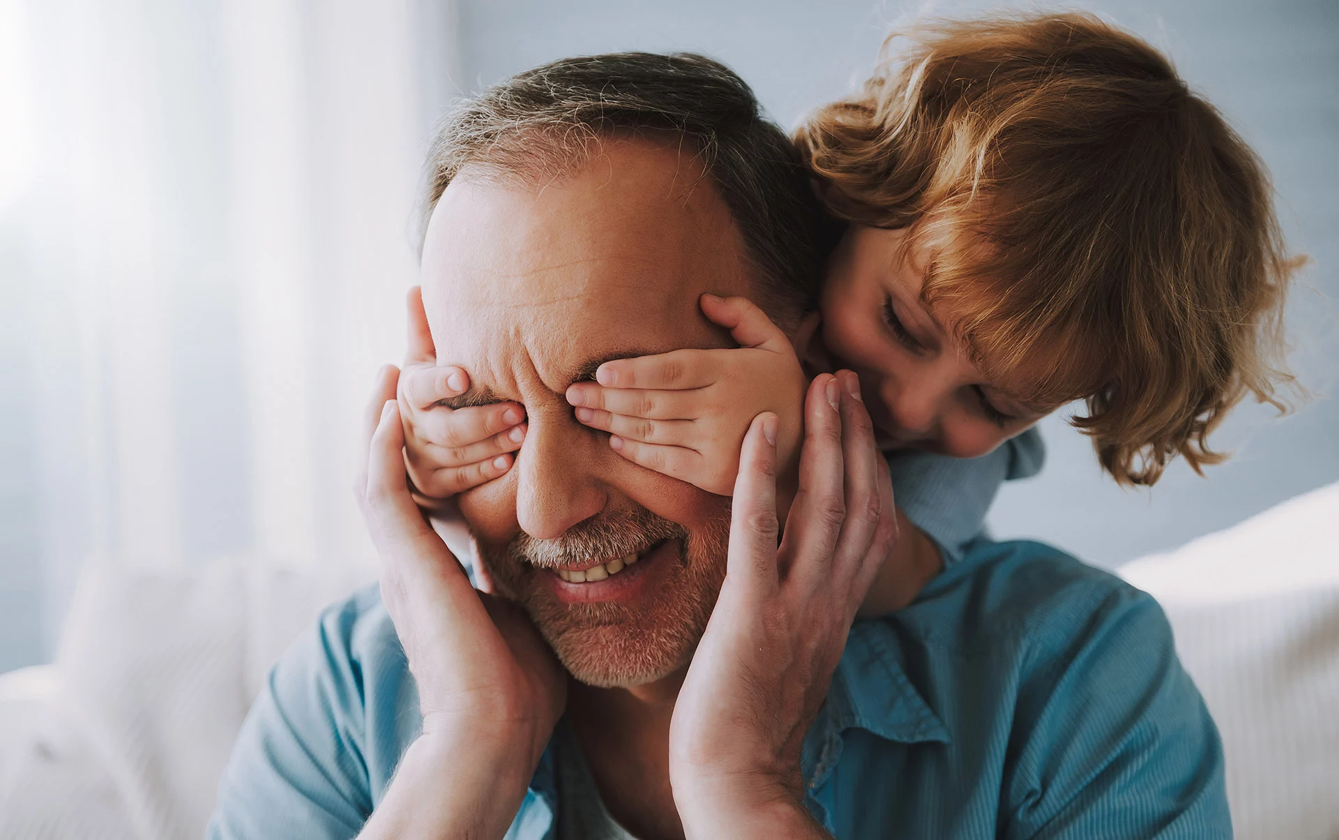 Grandfather playing with grandchild